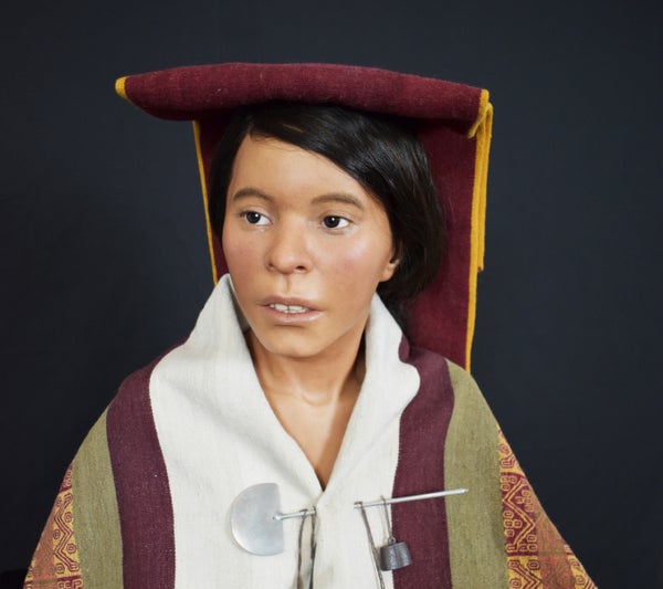 Portrait of the reconstruction of Ampato Maiden with white shirt and a white clothing pin