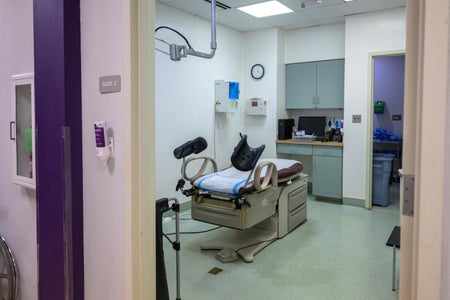 A view looking into an exam room at a clinic.