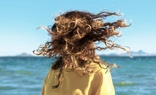 Why Hair Turns Curly and Frizzy in the Summer, according to Chemistry