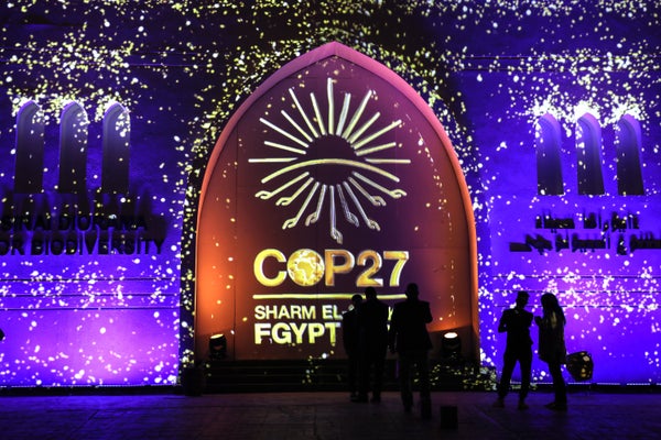 COP 27 sign w/ purple background