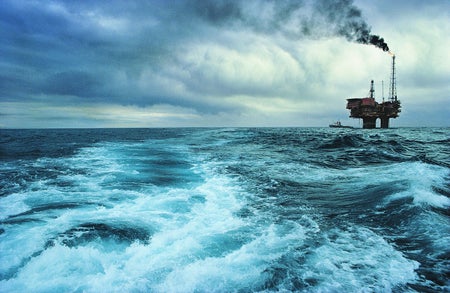 Off-shore oli rig in stormy sea.