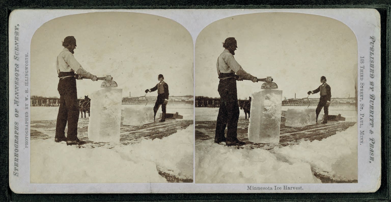 Old photograph of men harvesting ice.
