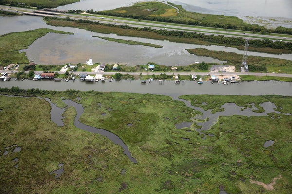 Homes surrounded by water due to rising sea level