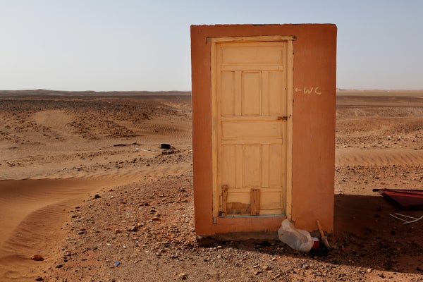 Wooden structure with door to a toilet in sahara