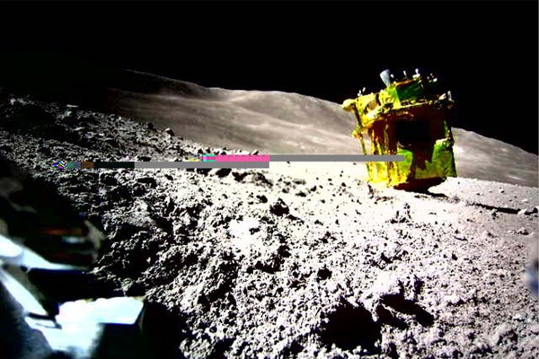 Moon lander upside down on the lunar surface.