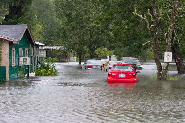 Cars flooded in Texas rural area.
