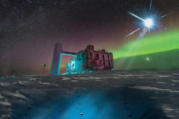 The IceCube Lab at the South Pole with aurora.