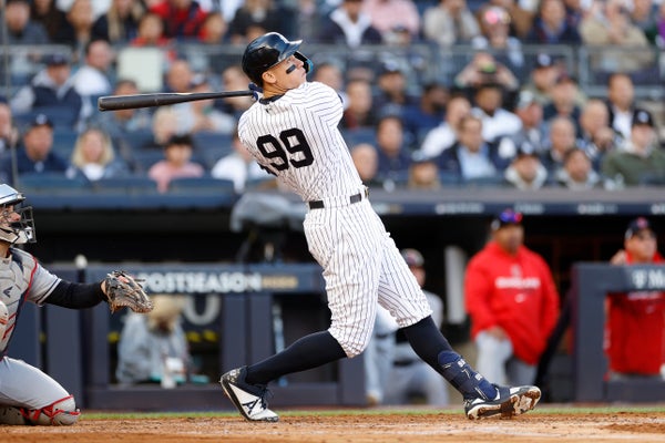 Aaron Judge #99 of the New York Yankees hits a home run.