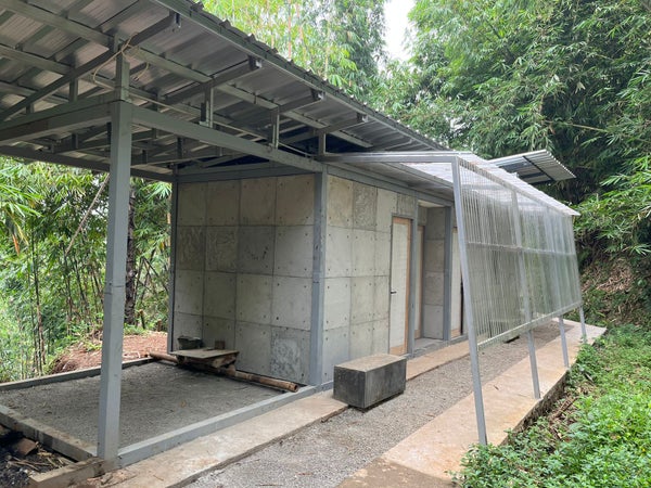 Exterior house structure  in Indonesia, built with concrete made by mixing cement, sand, gravel and shredded nappies.