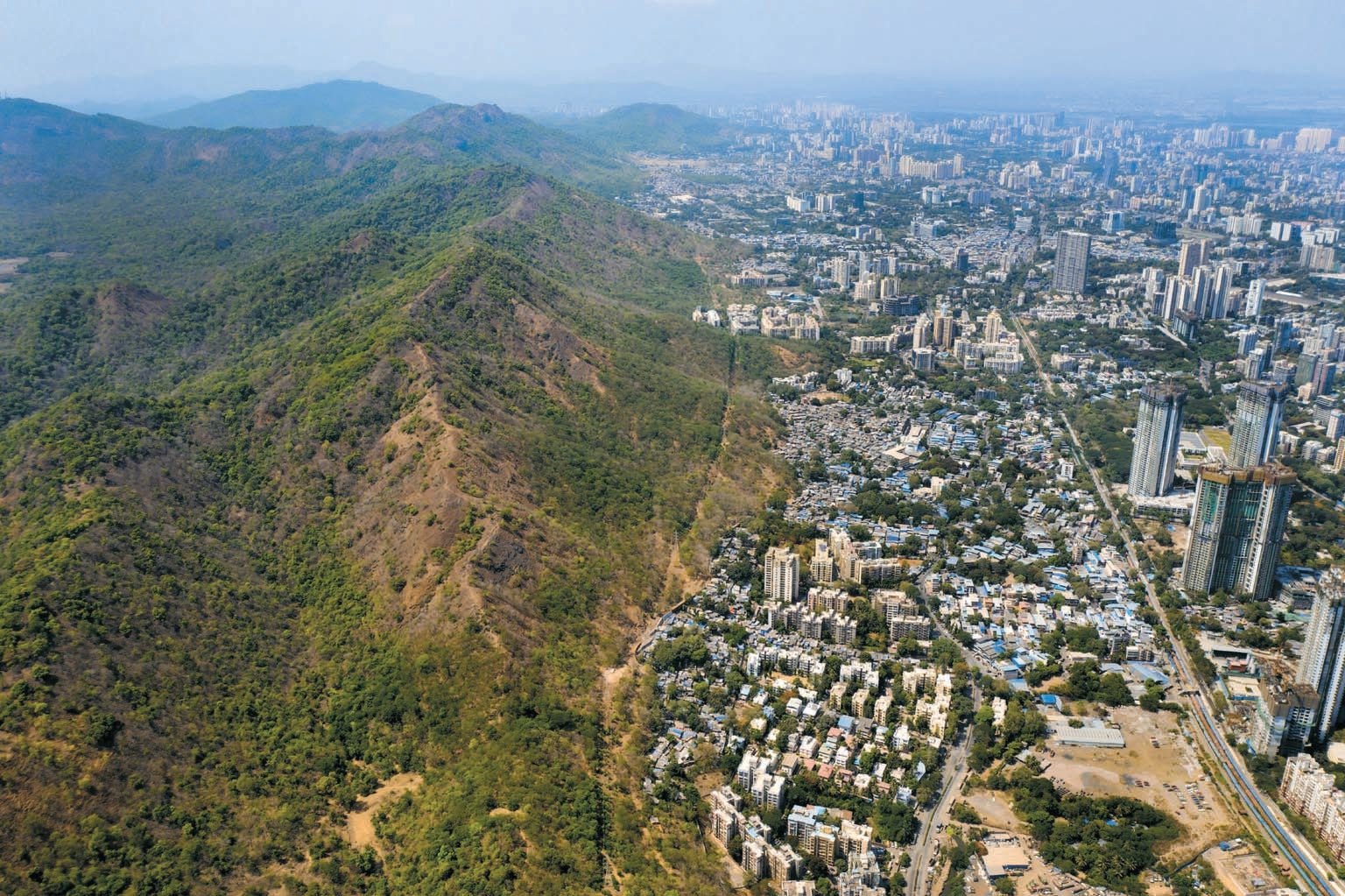 An aerial view of Mumbai showing protected wilderness adjacent to urban Mumbai.