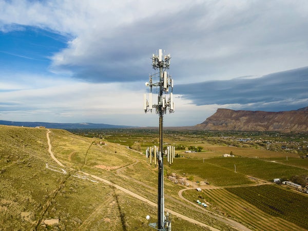 Drone POV of Rural America Telecommunications 5G Communications Tower in Western USA