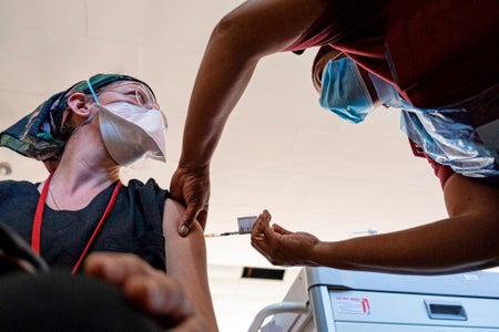 A health worker administers the Johnson & Johnson vaccine at the Chris Hani Baragwanath Hospital in Soweto on February 17, 2021.