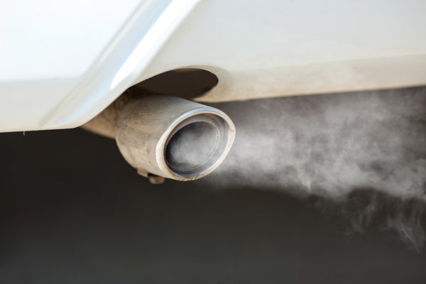 Exhaust flows out of the tailpipe of a vehicle.
