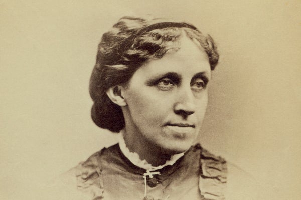 Sepia-tinted portrait photograph of Louisa May Alcott.