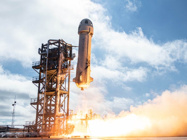 Blue Origin's New Shepard suborbital vehicle lifts off from its launchpad during a test flight.