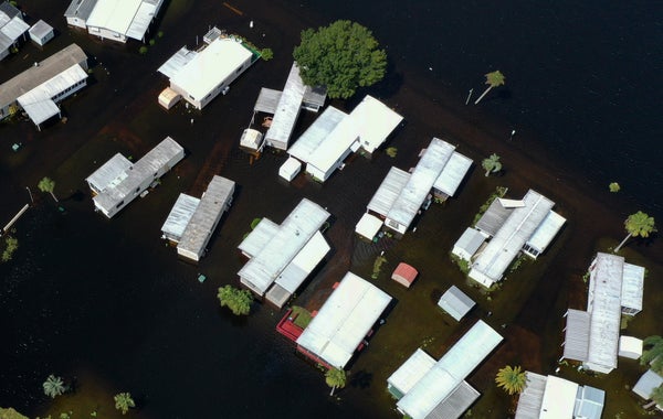 Aerial view of motorhomes in floodwater.