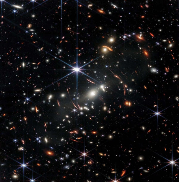 Galaxies from the depths of cosmic time appear in a small crop.