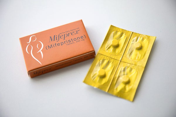 Mifepristone pill packaging on white table