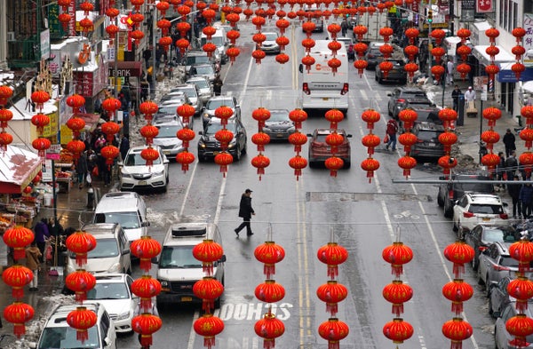 Traditional red lanterns hang over East Broadway in New York for the Red Lantern Festival.