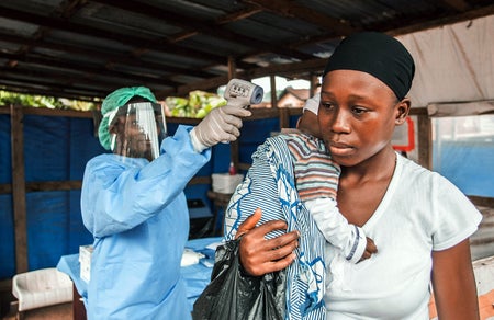 woman being checked for ebola