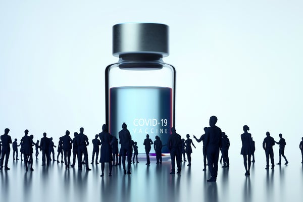 Illustrated giant COVID-19 vaccine bottle standing surrounded by people waiting for vaccine.