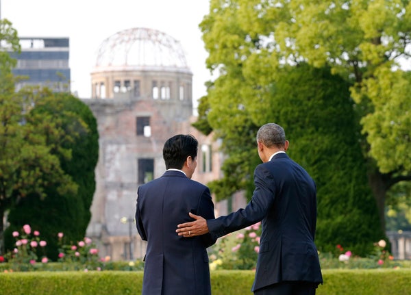 Presdent Barack Obama puts his hand on the shoulder of Japanese Prime Minister Shinzo Abe