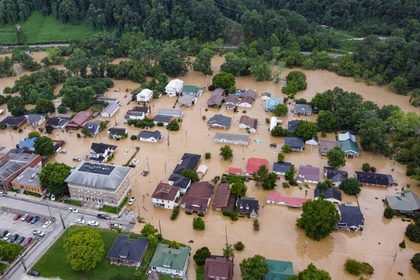 Aerial view of homes submerged under flood waters