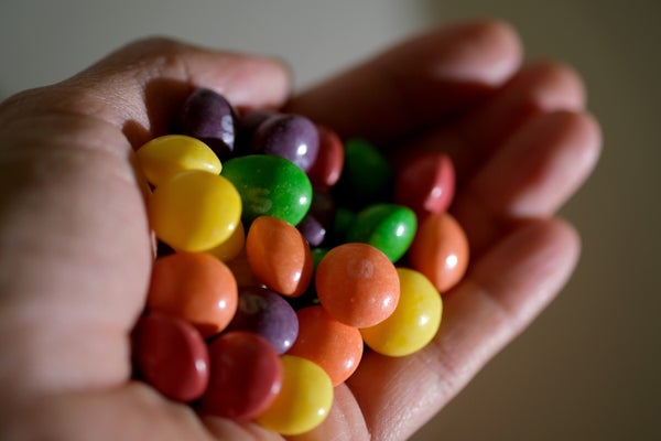 Hand holding brightly colored candy