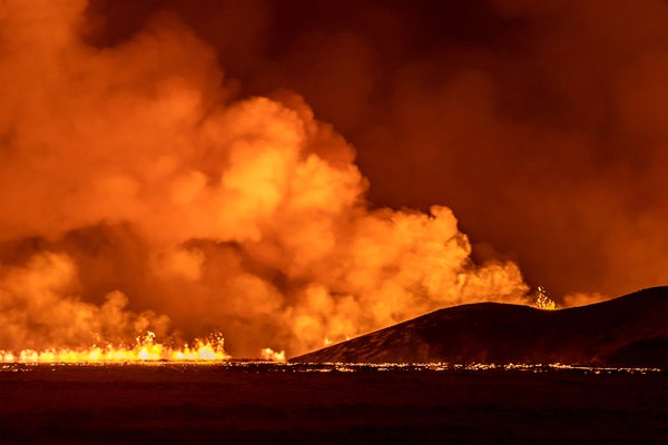Nighttime shot of volcano erupting