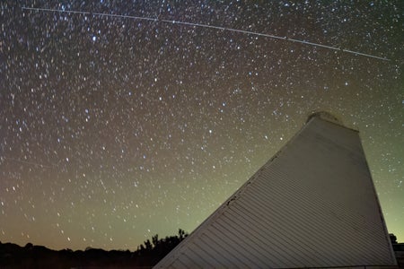 Trail left by BlueWalker 3 over McMath-Pierce Solar Telescope at Kitt Peak National Observatory, a Program of NSF's NOIRLab.