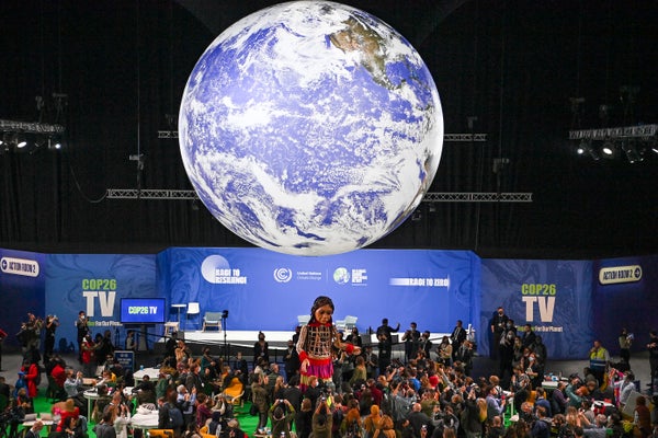 Little Amal, a giant puppet depicting a Syrian refugee girl, is seen at COP26.