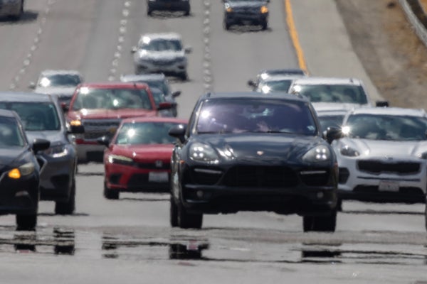 Cars on highway with heat radiating.