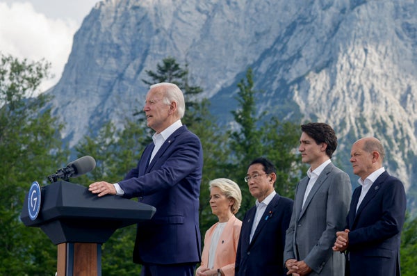 Joe Biden speaks next to other world leaders outdoor