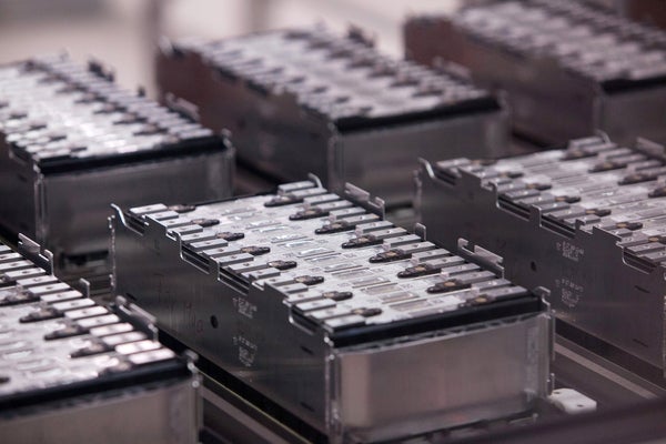 Close-up of electric care batteries on an assembly line.