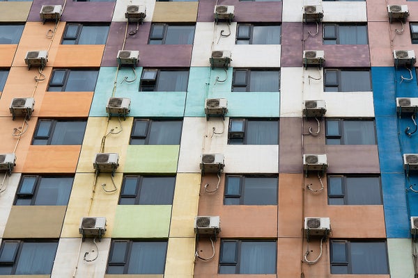 Colorful building exterior with external AC units