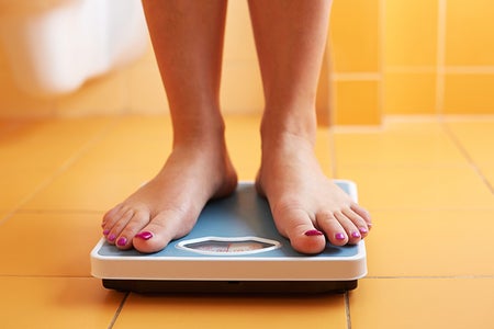 woman standing on a scale