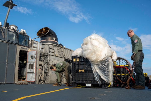 Recovered high-altitude balloon on deck of Navy ship.