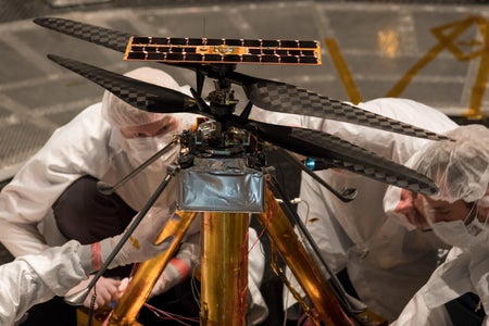 A photograph of NASA's Ingenuity helicopter inside a vacuum chamber