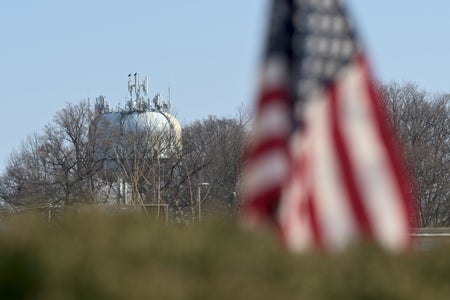 American flag with water tower in background