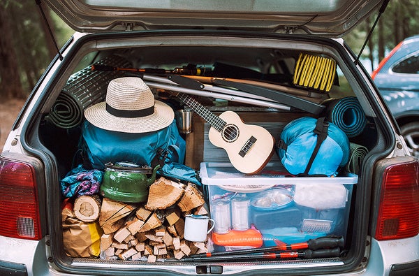 Shot of an open car trunk with camping equipment