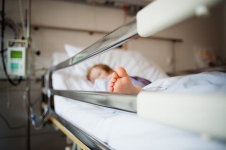 Little foot peeking out of hospital bed