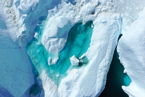 Meltwater forms a lake on an iceberg in the Ilulissat Icefjord in August 2019 near Ilulissat, Greenland.
