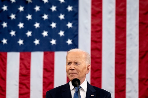 President Biden with American flag in background