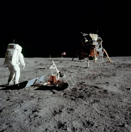 Buzz Aldrin setting up research equipment on the Moon