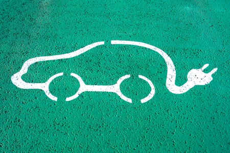 An electric vehicle charging station symbol.