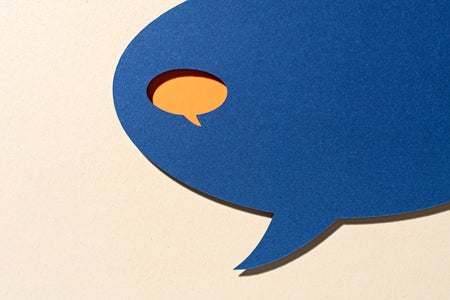 An Orange Colored Small Speech Bubble Inside a Large Blue Speech Bubble