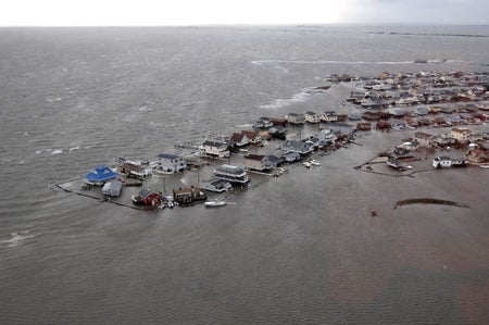 Aerial view showing homes submerged in ocean