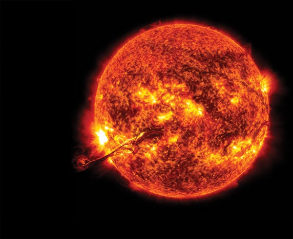 Solar flares and sheets of glowing plasma rise from a region of intense activity on the sun.