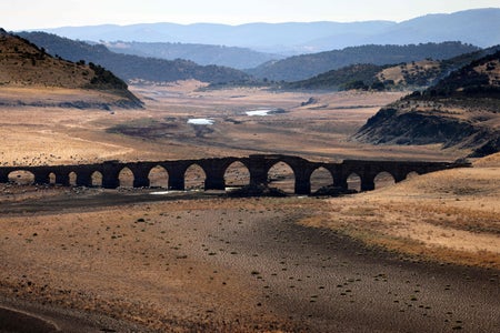 Medieval bridge over dried up Guadiana river
