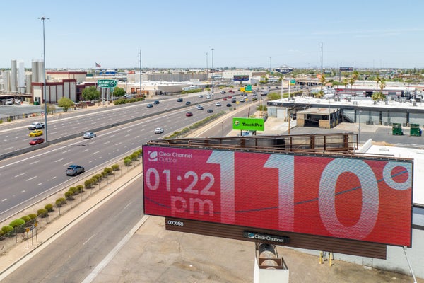 Billboard displaying temperature above highway